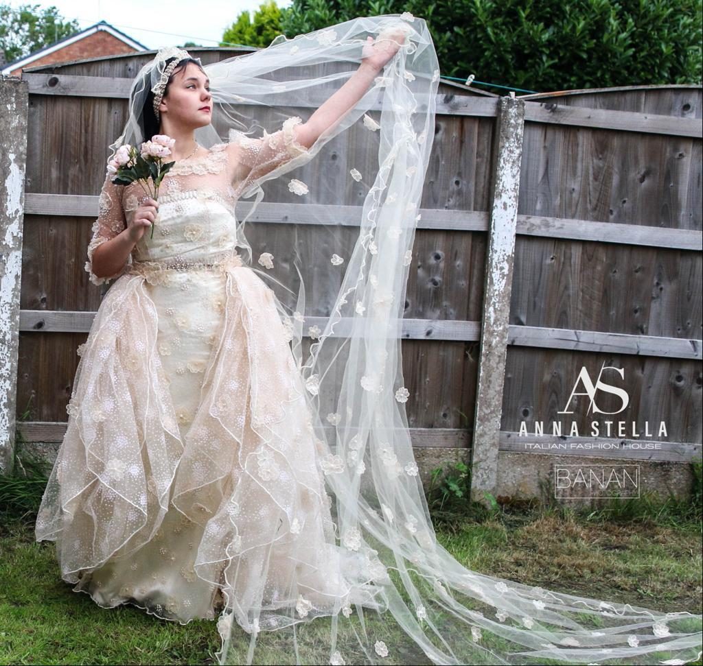 Bespoke wedding dress with lace flowers and long cathedral veil, made in Manchester